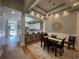 Open concept dining room with elegant tray ceiling and kitchen views at 620 Sunnyside Dr. # 102, Murrells Inlet, SC 29576