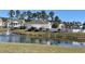 Community clubhouse overlooking a serene pond with a fountain and manicured lawn at 620 Sunnyside Dr. # 102, Murrells Inlet, SC 29576
