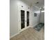 Well-lit hallway with decorative accents and tile flooring at 620 Sunnyside Dr. # 102, Murrells Inlet, SC 29576