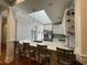 Kitchen with white cabinets, stainless appliances, countertop seating and skylight at 620 Sunnyside Dr. # 102, Murrells Inlet, SC 29576