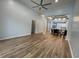 Open concept living room with hardwood floors that flows into dining area and kitchen at 620 Sunnyside Dr. # 102, Murrells Inlet, SC 29576