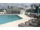 Outdoor community pool with lounge chairs and tables, offering a relaxing atmosphere at 620 Sunnyside Dr. # 102, Murrells Inlet, SC 29576