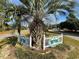 Bay Tree community entrance featuring lush greenery and a welcoming white picket fence at 1100 Wedge Way # 67, Little River, SC 29566