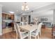 This open concept living space flows from a kitchen with stainless steel appliances to a dining area and living room at 1100 Wedge Way # 67, Little River, SC 29566