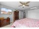 Main bedroom featuring a four-poster bed, ceiling fan, TV and a closet with panel doors at 1100 Wedge Way # 67, Little River, SC 29566