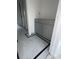 Bathroom with stylish black and white tile, gray cabinets, and sleek design, offering a fresh, modern space at 314 Hollywood Dr. S, Surfside Beach, SC 29575