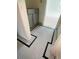 Bathroom with stylish black and white tile, gray cabinets, and sleek design, offering a fresh, modern space at 314 Hollywood Dr. S, Surfside Beach, SC 29575