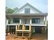 New construction home featuring a raised foundation and a charming front porch, offering a blend of style and functionality at 314 Hollywood Dr. S, Surfside Beach, SC 29575