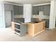Spacious kitchen featuring gray cabinetry, ample storage, and a blank canvas for customization with a large island at 314 Hollywood Dr. S, Surfside Beach, SC 29575