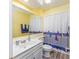 Cheerful bathroom showcasing a nautical-themed shower curtain at 86 Shadow Moss Pl. # 86, North Myrtle Beach, SC 29582