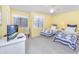 Bright guest bedroom with two twin beds, a ceiling fan, and ample natural light at 86 Shadow Moss Pl. # 86, North Myrtle Beach, SC 29582