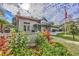 Inviting community clubhouse surrounded by lush landscaping and colorful flowers at 86 Shadow Moss Pl. # 86, North Myrtle Beach, SC 29582