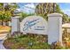 Shadow Moss: A Private Community sign surrounded by lush green foliage, indicating a serene and exclusive neighborhood at 86 Shadow Moss Pl. # 86, North Myrtle Beach, SC 29582