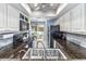 Functional kitchen featuring granite countertops and black appliances, offering a practical and stylish cooking space at 86 Shadow Moss Pl. # 86, North Myrtle Beach, SC 29582