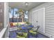 Screened porch with outdoor dining set, perfect for enjoying meals in a private outdoor setting at 86 Shadow Moss Pl. # 86, North Myrtle Beach, SC 29582