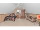 Cozy bedroom featuring comfortable bed, wood paneled walls, and soft carpet flooring at 865 River Rd., Tabor City, NC 28463