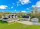 Stunning home boasts a sprawling lawn, charming front porch, additional garage, and separate building at 865 River Rd., Tabor City, NC 28463