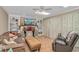 Cozy living room with tile floors, built-in shelving, and a fireplace with festive decor at 865 River Rd., Tabor City, NC 28463