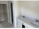 Bathroom featuring double sinks with white countertops and cabinets at 1038 Jase Dr., Longs, SC 29568