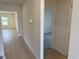 Neutral hallway featuring wood-look flooring that leads to other rooms at 1038 Jase Dr., Longs, SC 29568