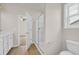 Bathroom featuring a glass enclosed shower, toilet, and vanity with modern fixtures at 1044 Jase Dr., Longs, SC 29568