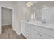 Bright bathroom with double vanity, white cabinets, and modern fixtures at 1044 Jase Dr., Longs, SC 29568