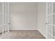 Empty bedroom featuring soft carpet and a glass-paned French door with white trim and neutral walls at 1044 Jase Dr., Longs, SC 29568