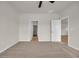 A spacious bedroom with neutral walls, plush carpet, and two entryways at 1044 Jase Dr., Longs, SC 29568