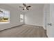 Sunny bedroom with plush carpet and windows providing nice views of the outdoors at 1044 Jase Dr., Longs, SC 29568