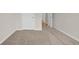 Comfortable bedroom with neutral carpeting and a doorway leading to another room at 1044 Jase Dr., Longs, SC 29568