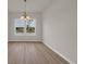 Inviting dining room with wood-look floors and a window providing scenic backyard views at 1044 Jase Dr., Longs, SC 29568