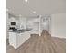 Bright kitchen featuring white cabinets, a granite island, and an open floor plan at 1044 Jase Dr., Longs, SC 29568