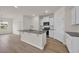 Modern kitchen island featuring granite counters and sleek, stainless steel appliances at 1044 Jase Dr., Longs, SC 29568
