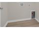 Bright laundry room with wood-look flooring and updated utility hook-ups at 1044 Jase Dr., Longs, SC 29568
