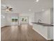Open living room boasts wood floors and great natural light from windows and sliding doors at 1044 Jase Dr., Longs, SC 29568