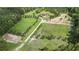 Aerial view of a horse property with fenced pastures, perfect for grazing, and ready for equestrian activities at 1692 S Morgan Ave., Andrews, SC 29510