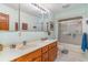 Bathroom featuring a double sink vanity and a shower with sliding glass doors at 1692 S Morgan Ave., Andrews, SC 29510