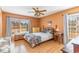 Cozy bedroom with natural light, soft colors, and wood laminate flooring at 1692 S Morgan Ave., Andrews, SC 29510