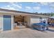 Backyard featuring a garage with an entertaining space, a covered hot tub, and a fenced-in pool at 1692 S Morgan Ave., Andrews, SC 29510