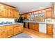 Classic kitchen with wood cabinets, solid surface counters, and a view of the outside at 1692 S Morgan Ave., Andrews, SC 29510