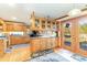 Open kitchen with hardwood floors, wood cabinets, and a convenient door to a deck at 1692 S Morgan Ave., Andrews, SC 29510