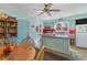 Cheerful kitchen with light blue walls, complemented by a cozy breakfast nook, and ample counter space at 1692 S Morgan Ave., Andrews, SC 29510