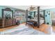 Main bedroom with a four poster bed, blue walls, and decorative furnishings at 1692 S Morgan Ave., Andrews, SC 29510