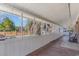 Enclosed porch with wood floors and views of the backyard and greenery at 1692 S Morgan Ave., Andrews, SC 29510