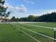 Outdoor riding arena with jumps and white vinyl fencing at 1692 S Morgan Ave., Andrews, SC 29510