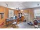 Well-lit tack room with ample storage and seating, designed to keep equestrian gear organized and easily accessible at 1692 S Morgan Ave., Andrews, SC 29510