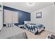 Charming bedroom with twin beds, blue accents, and a calm, inviting atmosphere at 191 Maison Dr. # B203, Myrtle Beach, SC 29572