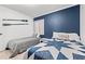 Inviting bedroom with two beds, featuring blue accents and natural light at 191 Maison Dr. # B203, Myrtle Beach, SC 29572