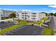 Exterior of condo building with palm trees, landscaping, and paved parking lot at 191 Maison Dr. # B203, Myrtle Beach, SC 29572