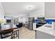 Cozy condo with open concept living area and adjacent kitchen with a view to the balcony at 191 Maison Dr. # B203, Myrtle Beach, SC 29572